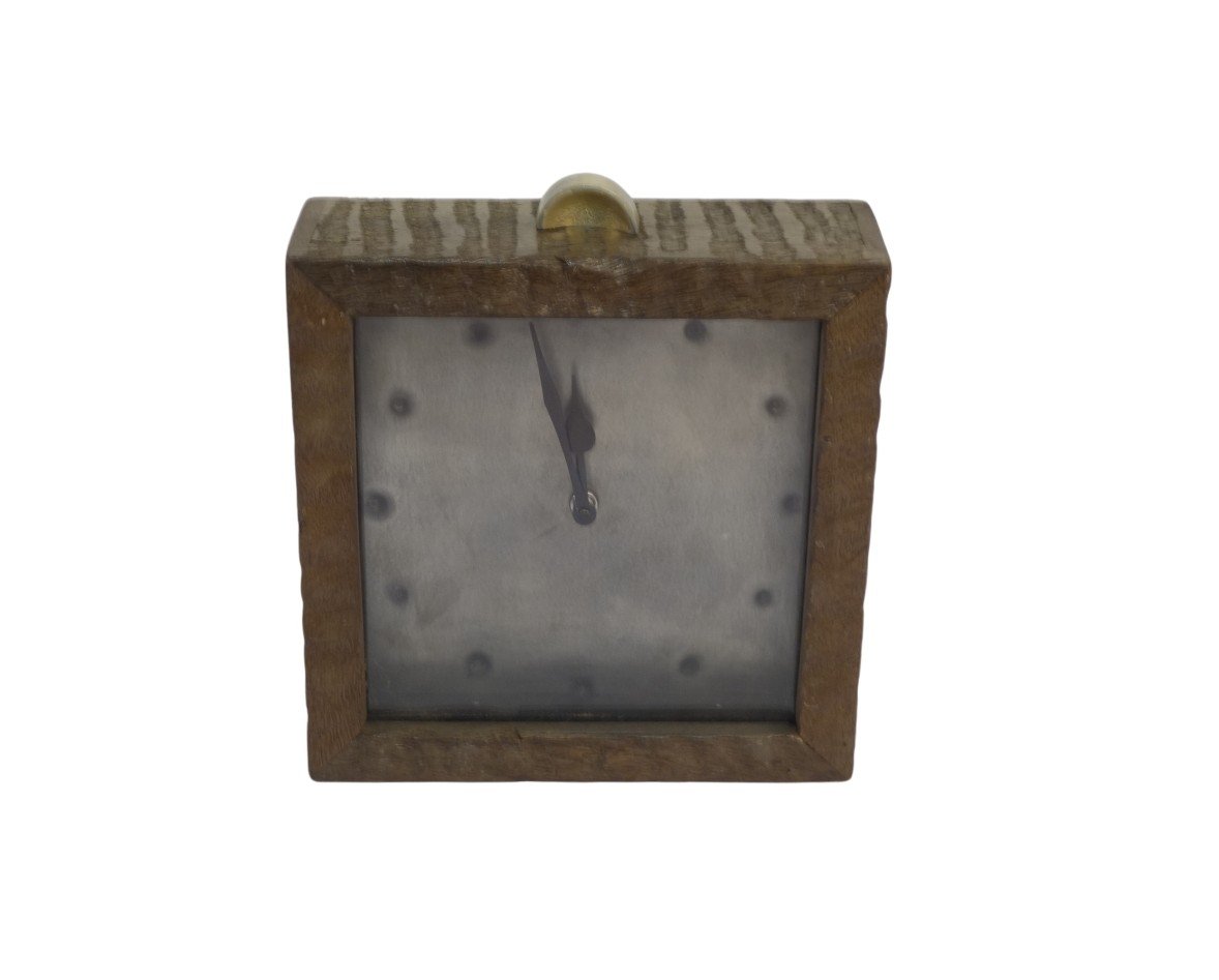 Wooden striped clock with riveted dial